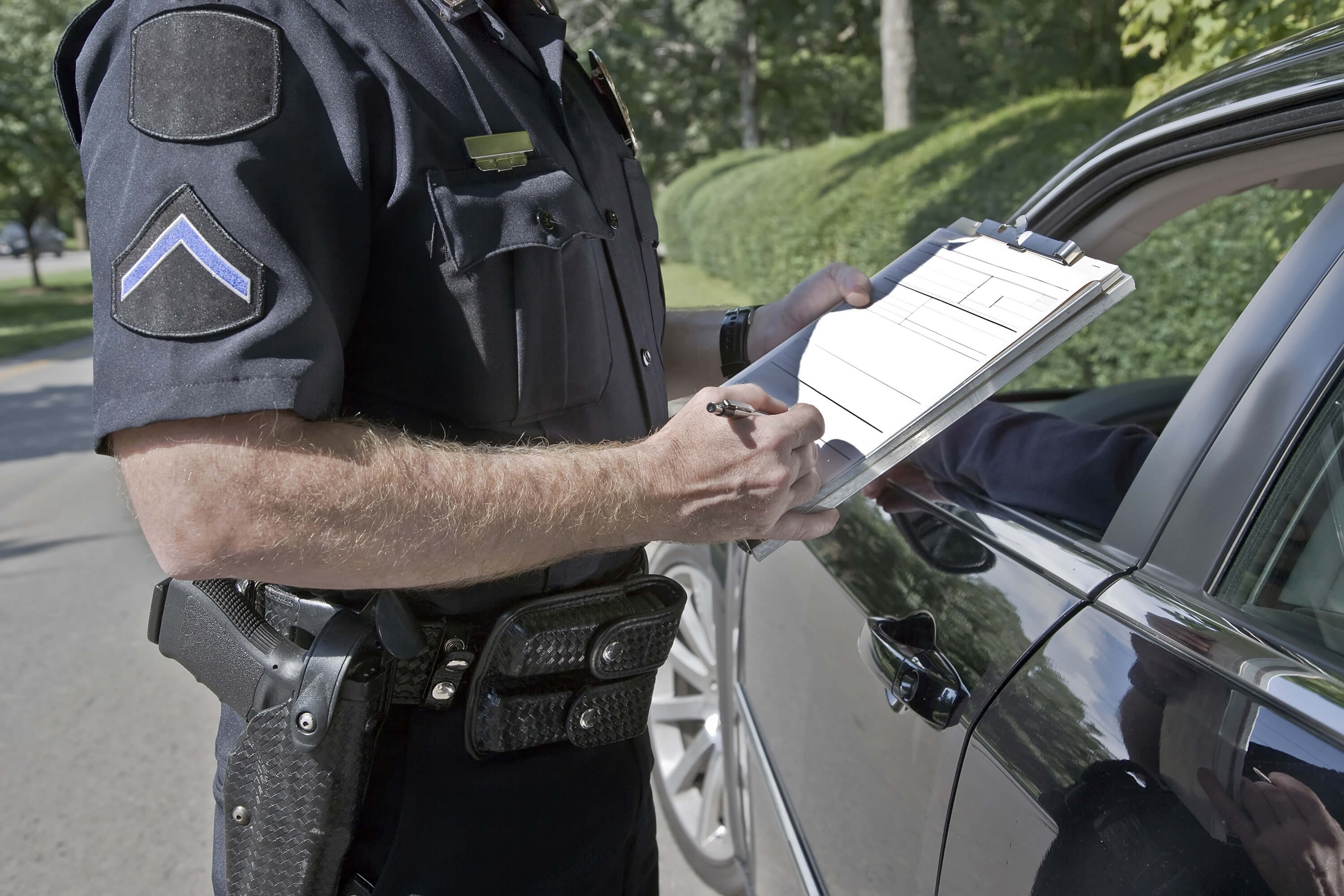 Officer writing a  citation